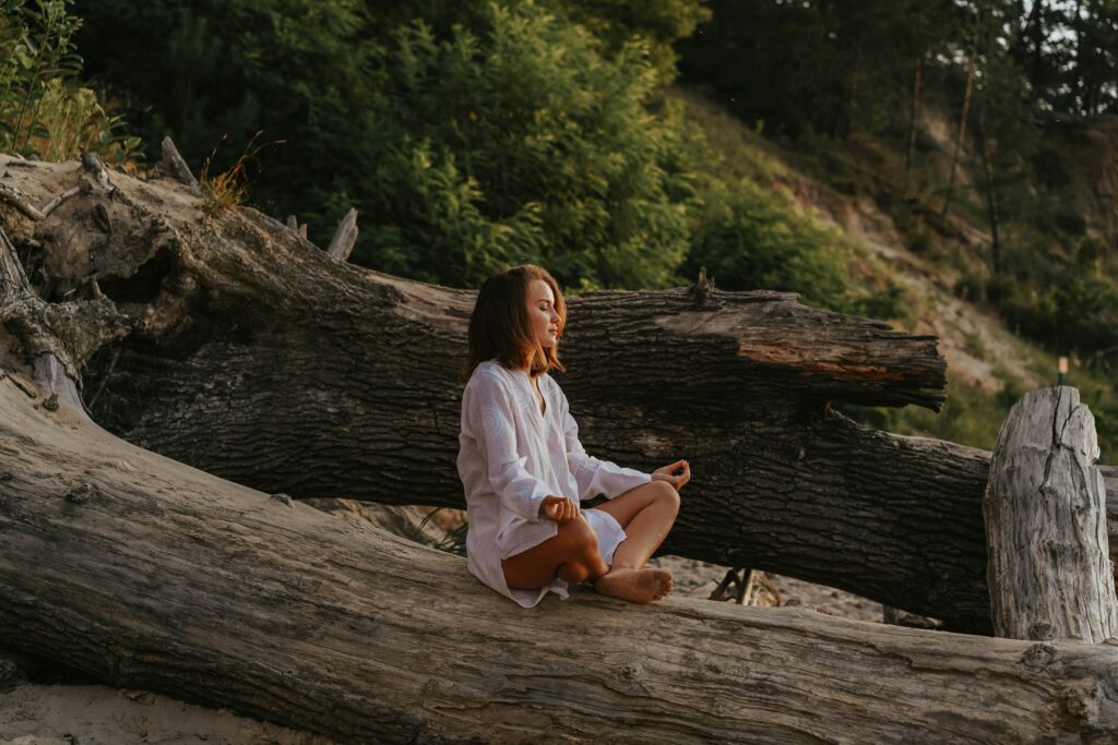 Peaceful sitting on a tree trunk